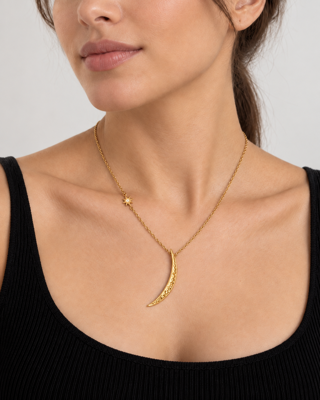 Model wearing VEYRISSA Crescent Star Drop Necklace
